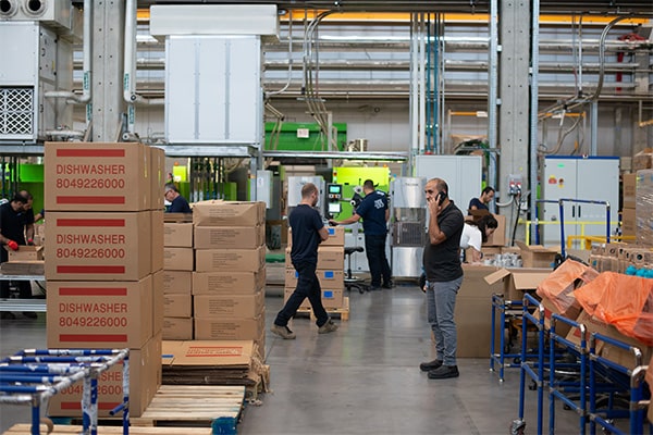 Shelves of wholesale goods and stacked cartons in a warehouse